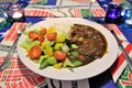 Creole stew with salad and rice